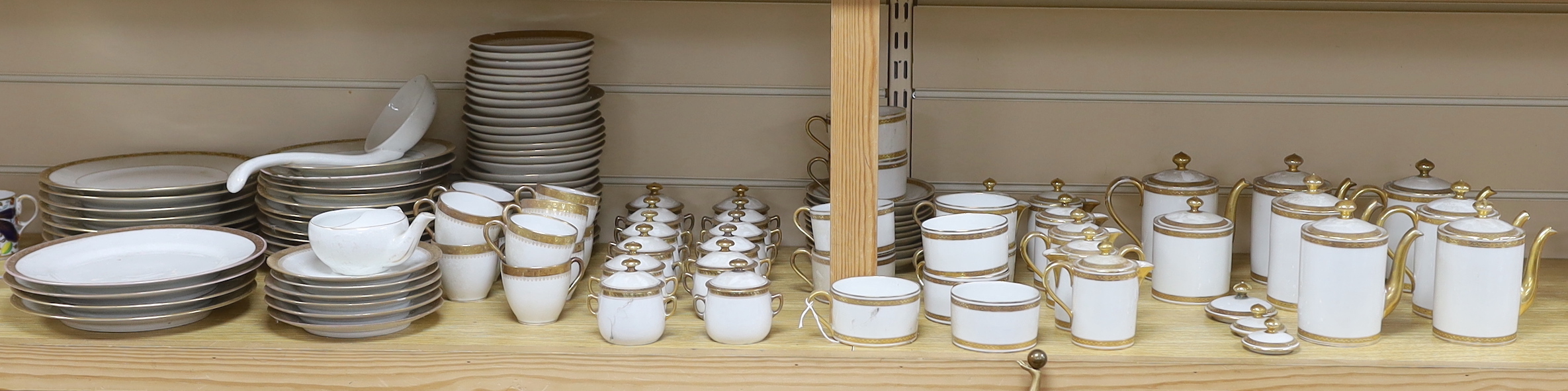 Three French Limoges gilt banded part dinner and tea services including cups, plates and jars & covers